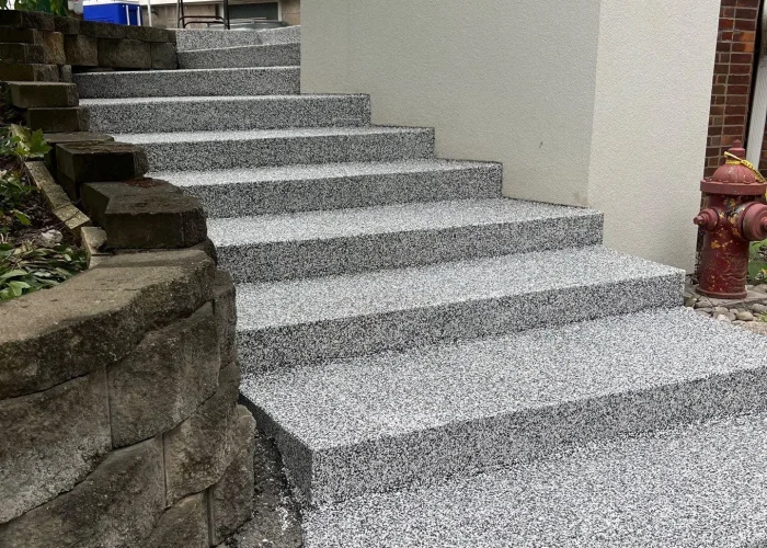 cracked-concrete-steps-rochester-ny-after-repair Finished coated concrete steps with anti slip texture in Webster and Penfield NY by garage floor coating contractor