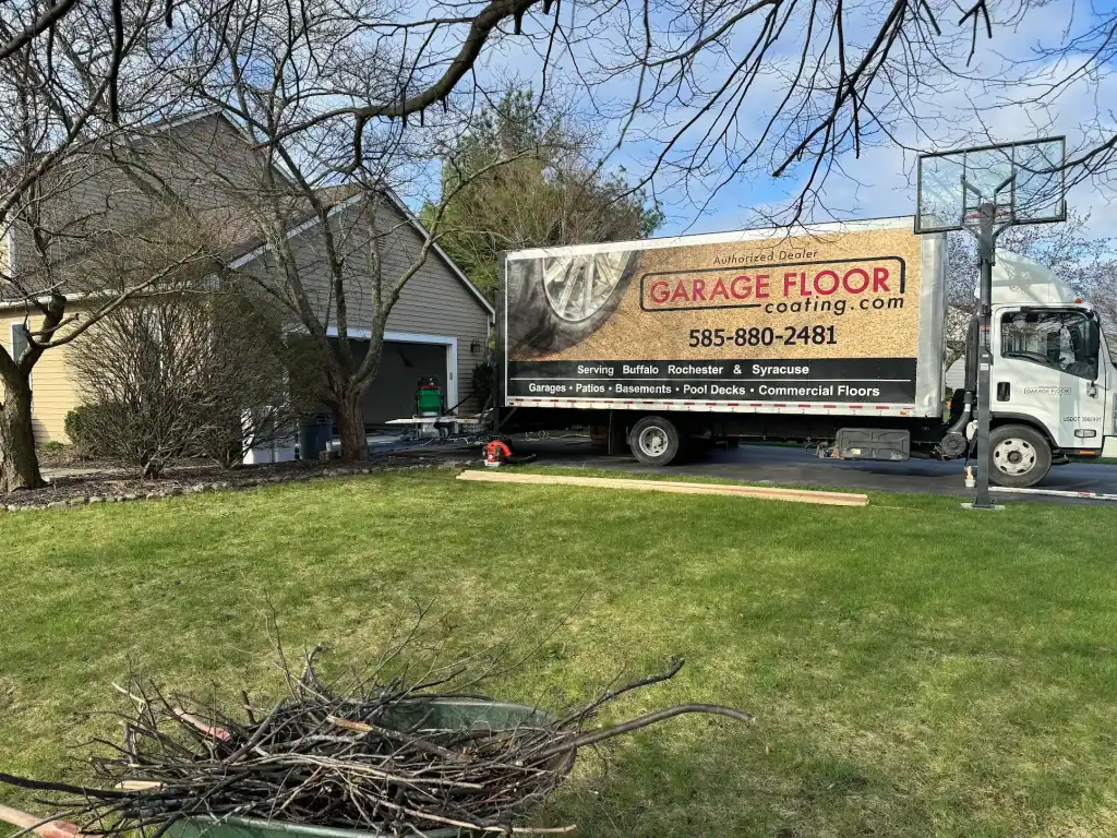 garage-floor-coatings-rochester-ny-truck Garage Floor Coating truck setup outside residential home in Rochester and surrounding Monroe County NY